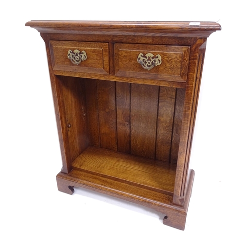 2044 - A small modern oak bookcase, with 2 frieze drawers and open shelves under, on bracket feet, W61cm, H... 