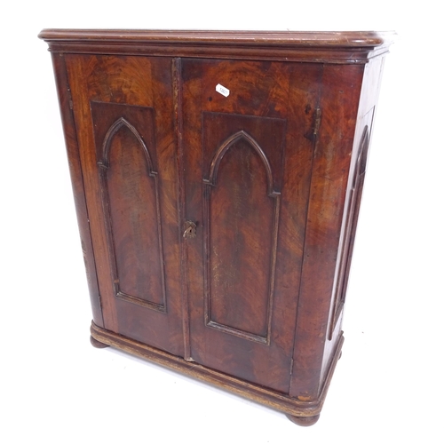 2047 - A 19th century mahogany side cabinet of small size, with lancet-panelled sides and doors, on bun fee... 