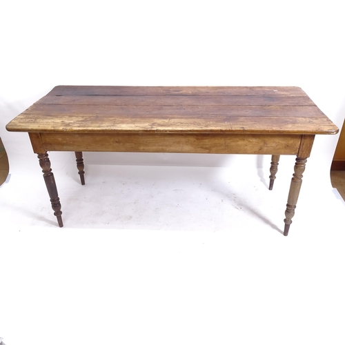 2050 - An Antique elm and pine plank-top kitchen table, with end frieze drawer and opposing slide, raised o... 