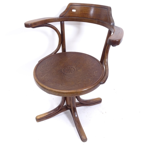 2067 - An early 20th century Thonet rise and fall swivel desk chair, with paper label to the underside