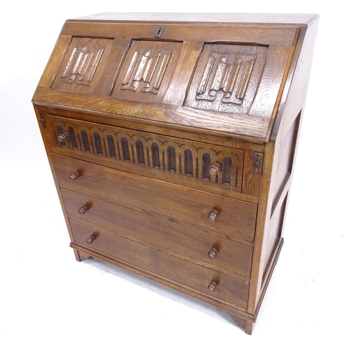 2079 - A linenfold carved and panelled oak 4-drawer bureau, W77cm, H92cm, D43cm