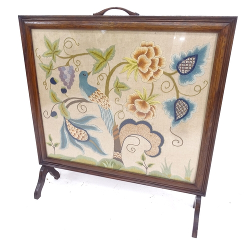 2093 - An Edwardian oak-framed fire screen, with and inset woolwork panel, W77cm, H82cm