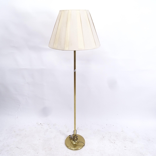 2095 - A brass-effect standard lamp and shade, height including shade 157cm