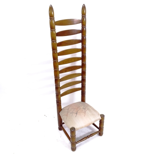 2102 - A mid-century tall ladder-back chair, in the manner of Charles Dudouyt