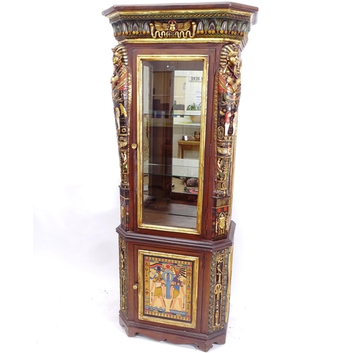 2103 - An Egyptian Revival design display cabinet, with a single-glazed and panelled cupboard door, and all... 