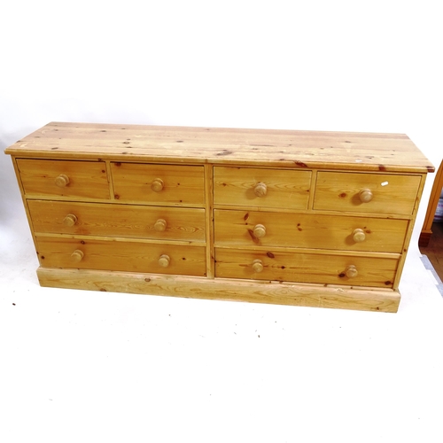 2106 - A long low pine 8-drawer chest, L183cm, H75cm, D44cm