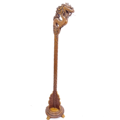 2126 - A Chinese design stained and carved standard lamp in the form of a dragon, on stepped base, H183cm