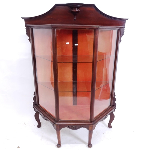 2128 - An Edwardian mahogany glass display cabinet of canted form, on cabriole legs, W105cm, H145cm, D36cm