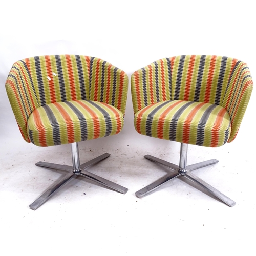 2133 - ORANGE BOX - a pair of upholstered swivel chairs on flat steel legs, from the HY Collection