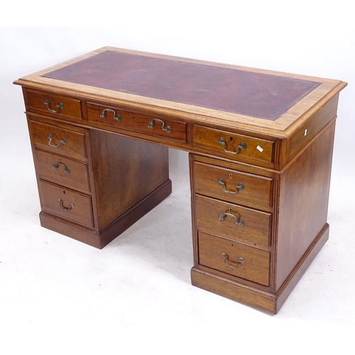 2145 - An Edwardian mahogany twin-pedestal writing desk, W121cm, H75cm, D62cm, kneehole width 42cm and heig... 