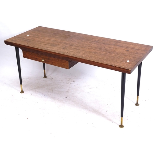 2149 - An unusual mid-century teak rise and fall table of rectangular form, with push-through frieze drawer... 