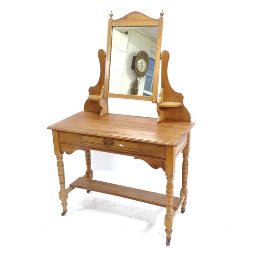 2162 - An Edwardian satinwood dressing table, with single drawer, on turned legs, W91cm, H147cm, D46cm