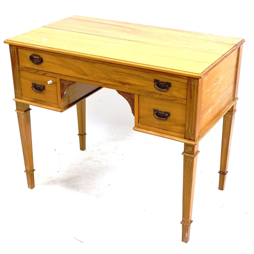 2167 - An Arts and Crafts satin-walnut kneehole writing desk, with 3 drawers, on fluted tapered legs, W94cm... 