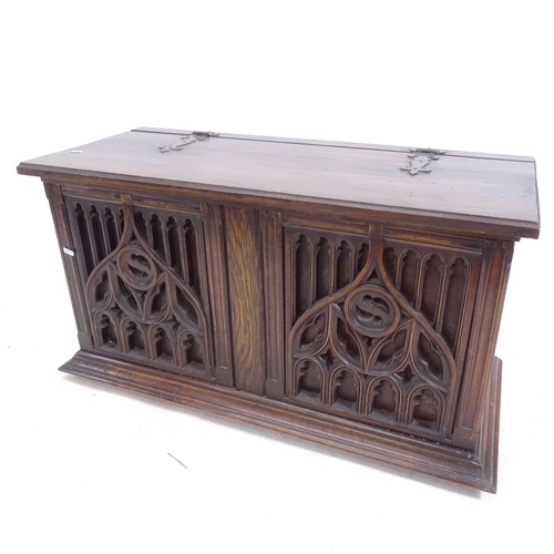 2172 - An Antique oak coffer, with Gothic carved and pierced design panelled front, on bun feet, W94cm, H50... 