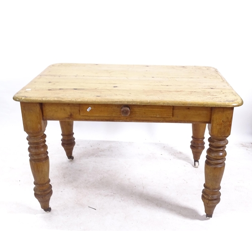 2183 - A Victorian pine round-cornered kitchen table, with single frieze drawer, on turned legs, W120cm, H7... 