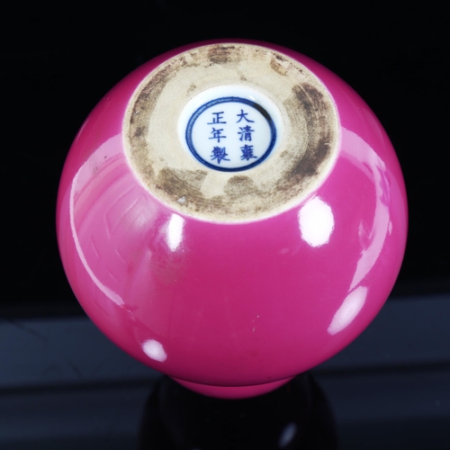 104 - A Chinese pink ground porcelain double-gourd vase, 6 character mark on base, height 23cm