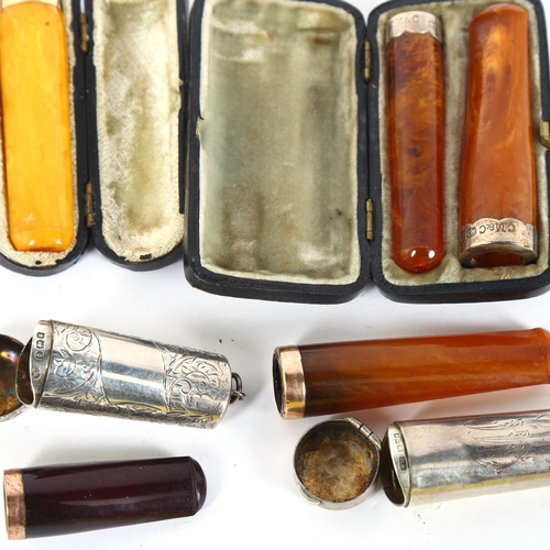 116 - 5 Vintage amber cheroot holders, including 15ct, 9ct and silver-mounted examples, and 2 silver cases