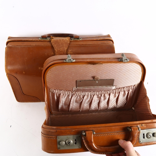 120 - A leather Gladstone bag, and similar vanity case (2)