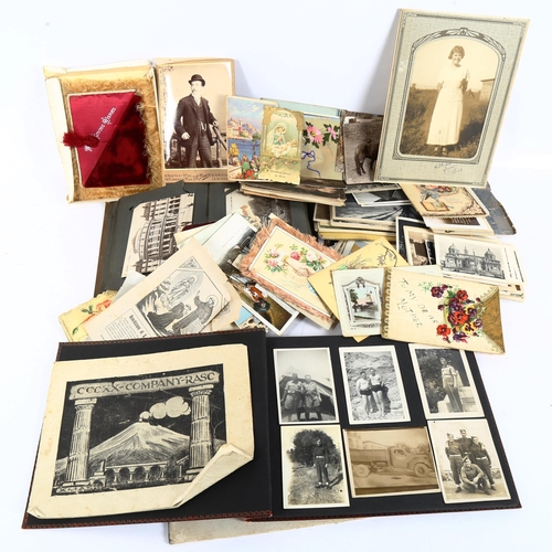 122 - A group of Vintage loose postcards, postcard albums, photograph albums etc