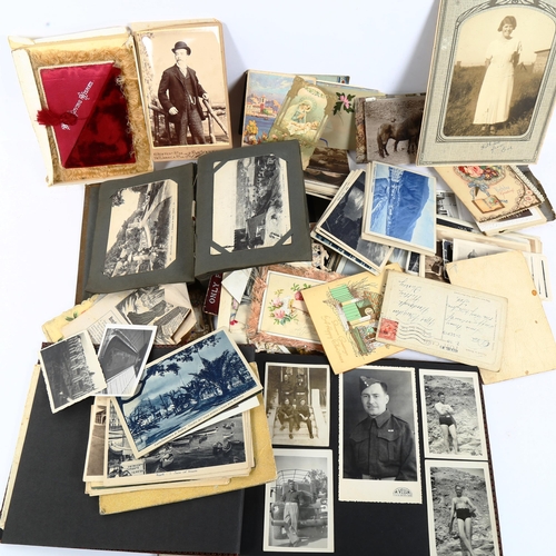 122 - A group of Vintage loose postcards, postcard albums, photograph albums etc