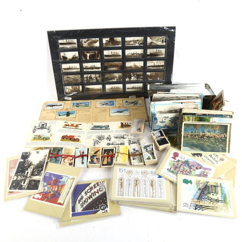 124 - A quantity of Vintage cigarette cards, loose topographical postcards etc