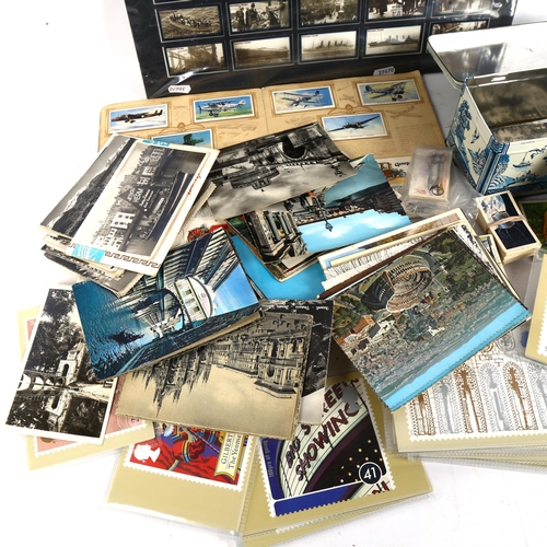 124 - A quantity of Vintage cigarette cards, loose topographical postcards etc