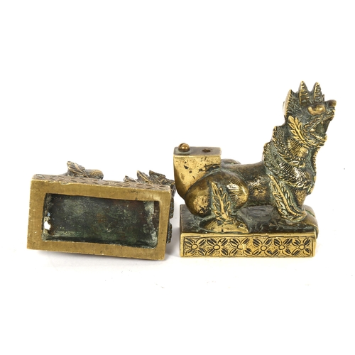 87 - A pair of Oriental cast-brass temple lions, height 11cm