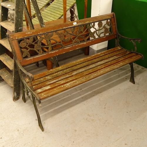 2686 - A slatted and wrought-iron garden bench, L217cm