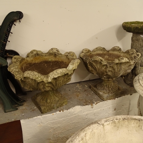 2690 - A pair of weathered concrete garden planters on stands, W55cm, H45cm