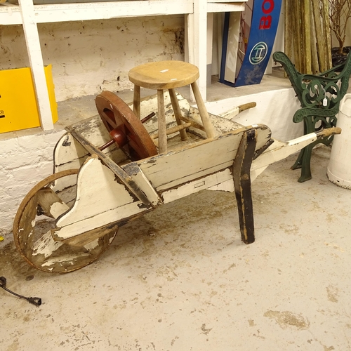 2720 - A Vintage painted wheelbarrow, an elm stool etc (3)