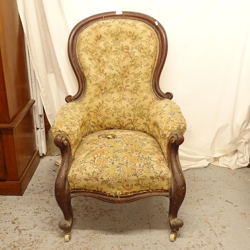 2729 - A Victorian upholstered and mahogany-framed armchair