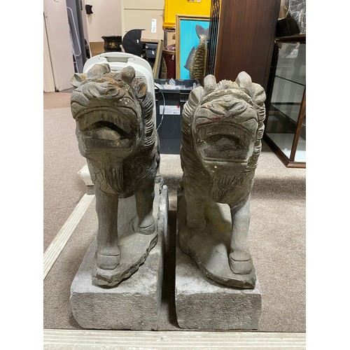 2721 - A pair of Chinese Dogs of Foo / Lion carved basalt figures on granite plinths, height 73cm. (Viewing... 