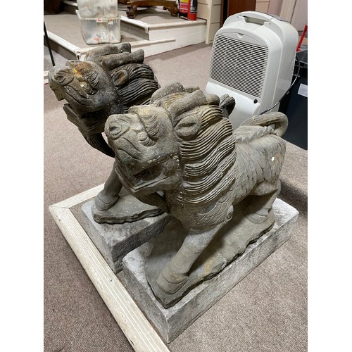 2721 - A pair of Chinese Dogs of Foo / Lion carved basalt figures on granite plinths, height 73cm. (Viewing... 