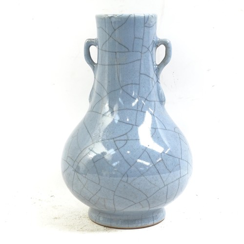 90 - A Chinese blue crackle glaze pottery vase, Hu, height 21cm