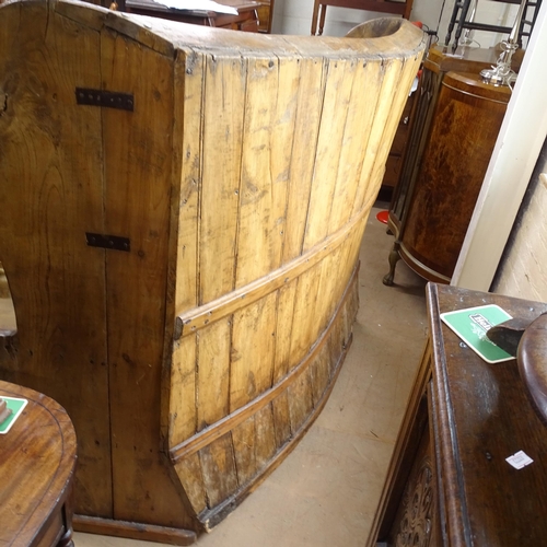 2022 - A large Antique stained pine bow-back settle, H140cm, L165cm