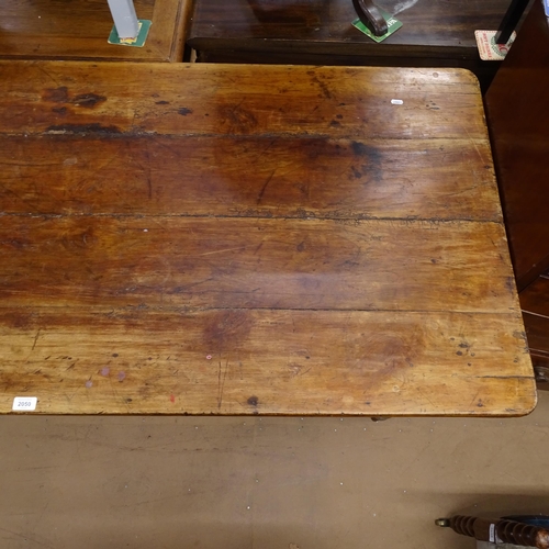 2050 - An Antique elm and pine plank-top kitchen table, with end frieze drawer and opposing slide, raised o... 