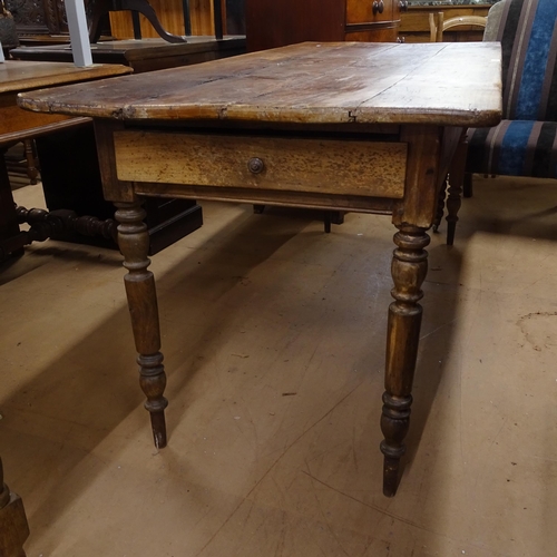 2050 - An Antique elm and pine plank-top kitchen table, with end frieze drawer and opposing slide, raised o... 