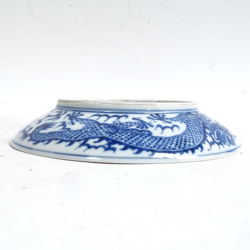 102 - A Chinese blue and white porcelain 'Dragon' plate, depicting 5-claw dragon chasing flaming pearl, 6 ... 