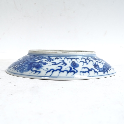 102 - A Chinese blue and white porcelain 'Dragon' plate, depicting 5-claw dragon chasing flaming pearl, 6 ... 