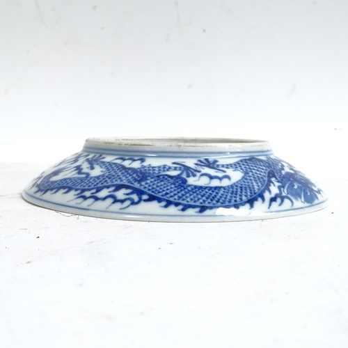 102 - A Chinese blue and white porcelain 'Dragon' plate, depicting 5-claw dragon chasing flaming pearl, 6 ... 