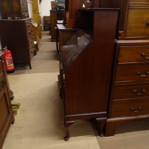 2092 - An Edwardian mahogany bureau, with shaped raised shelf, 3 long drawers and open shelf below, on cabr... 