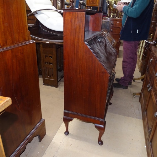 2092 - An Edwardian mahogany bureau, with shaped raised shelf, 3 long drawers and open shelf below, on cabr... 