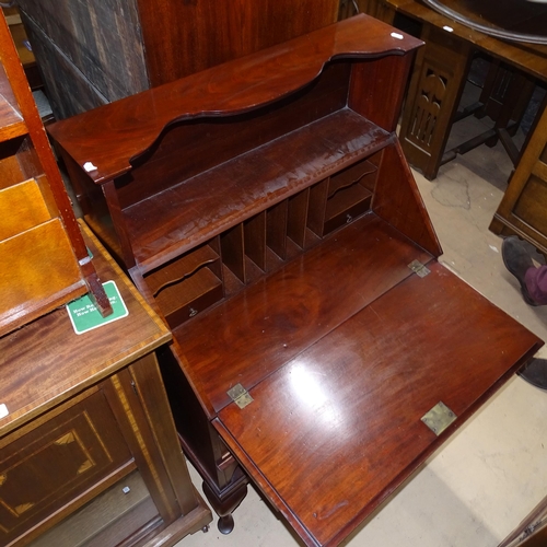 2092 - An Edwardian mahogany bureau, with shaped raised shelf, 3 long drawers and open shelf below, on cabr... 