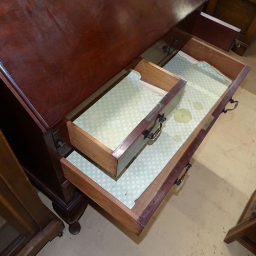 2092 - An Edwardian mahogany bureau, with shaped raised shelf, 3 long drawers and open shelf below, on cabr... 