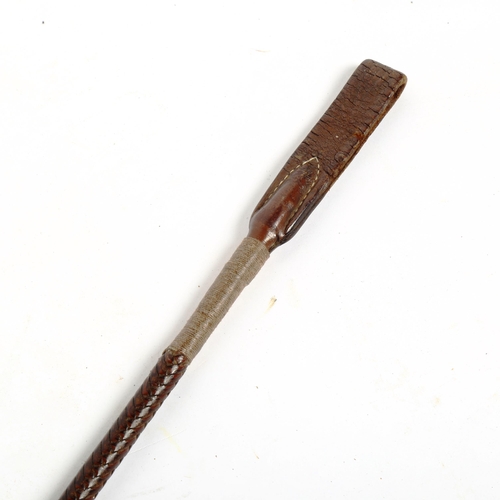 12 - A leather riding crop, with handwritten note from Luca M Cumani of Bedford House Stables Suffolk, le... 