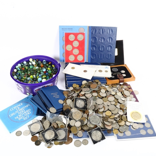 134 - A quantity of world coins and glass marbles (boxful)