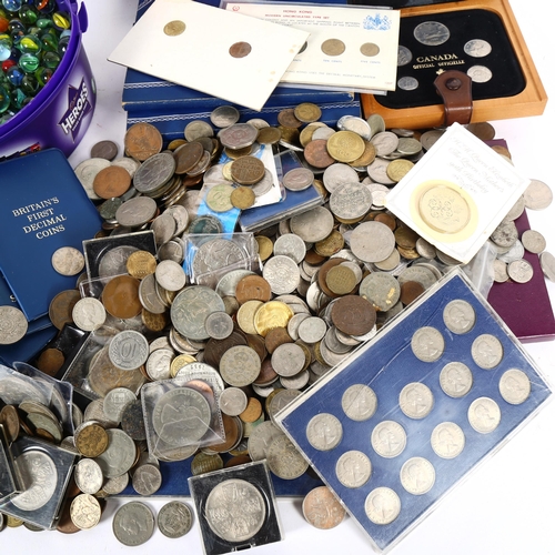 134 - A quantity of world coins and glass marbles (boxful)