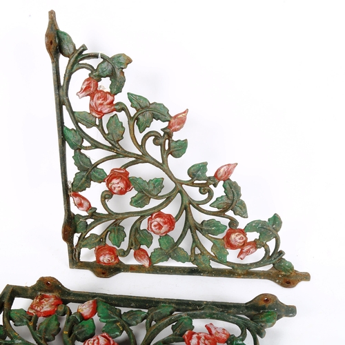 145 - A pair of painted cast-iron rose wall brackets, height 44cm