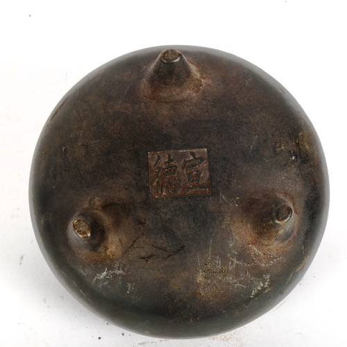 151 - A Chinese bronze tripod incense burner, character mark on base, diameter 12cm