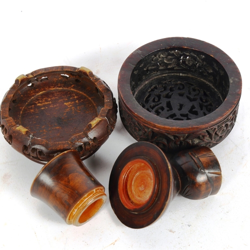 178 - A Folk Art treen figural box with bone dice, and a Chinese hardwood stand and cover (3)